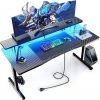 Amazon:$49.29 ($109.98)GTRACING 55 Inch Gaming Desk with LED Lights, Computer Gamer Desk with Monitor Stand, Ergonomic Carbon Fiber Surface Gaming Table with Mouse Pad for Home Office, RGB